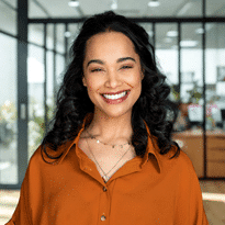 Woman smiling with a joyful expression.