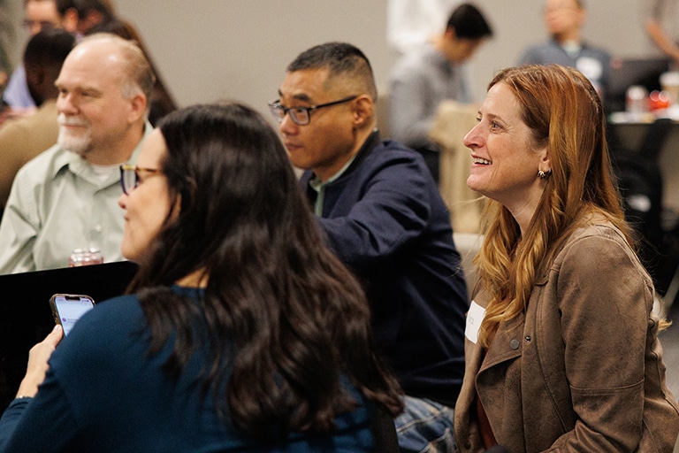 Bamboo Insurance employees interacting in a large meeting space.