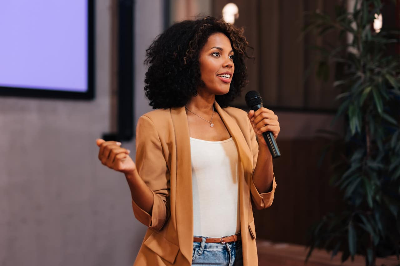 Female speaker presenting.